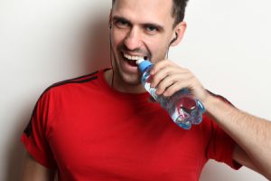 Man Opens Bottle Water Using Teeth