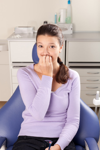 Woman Embarrassed in Dental Chair