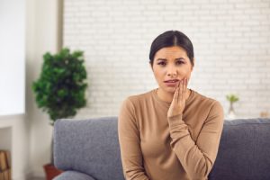 Young Woman with Jaw Pain